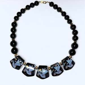 Black and gold beaded necklace with geometric patterned beads #boho #festival